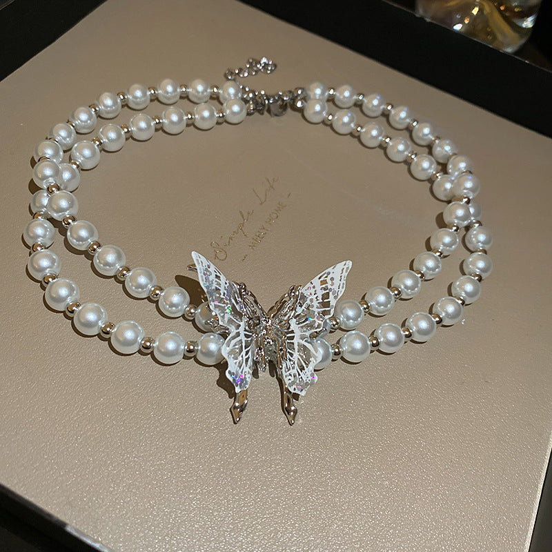 Elegante collar de mariposa de doble capa estilo francés con imitación de perla y colgante de cristal para mujer, cadena de clavícula