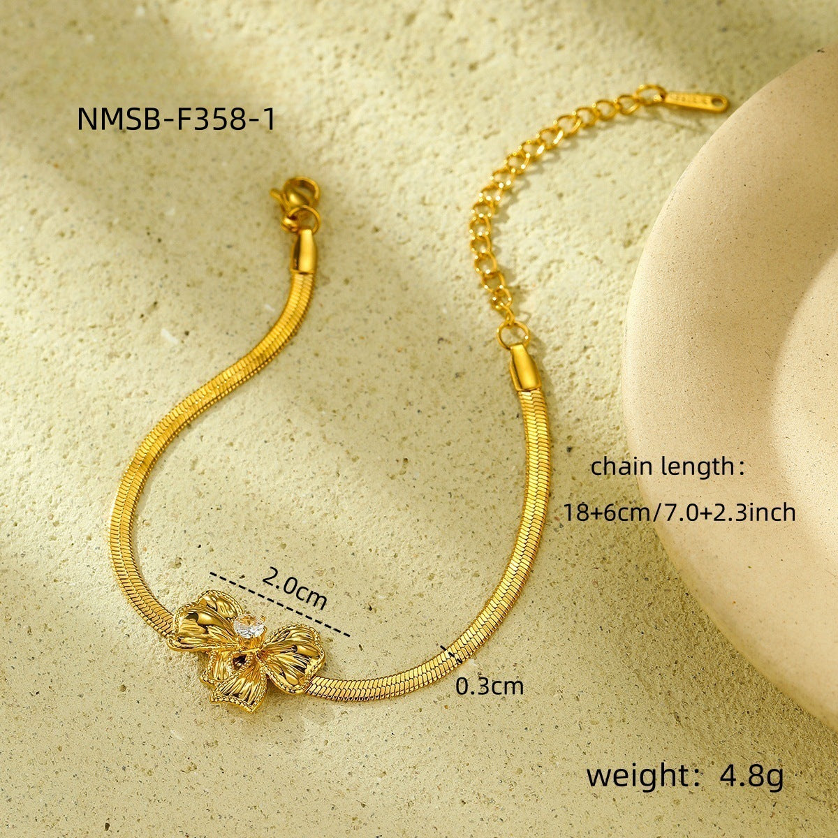 Orecchini da donna in acciaio inossidabile a forma di fiocco, alla moda, con finitura placcata e un fascino lussuoso e minimalista