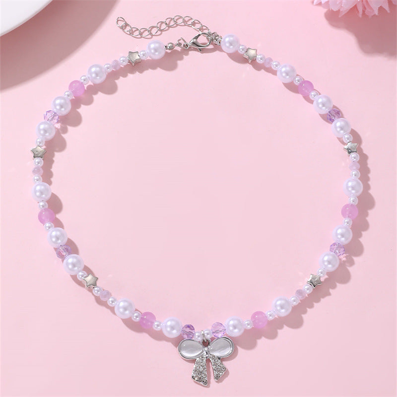 Set di collana per bambine a forma di fiocco minimalista in resina con braccialetto di perline per bambine dai 3 ai 10 anni