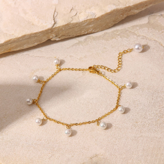 Tobillera minimalista geométrica de acero inoxidable chapado en oro de 18 quilates con colgante de borla de perlas de concha para mujer