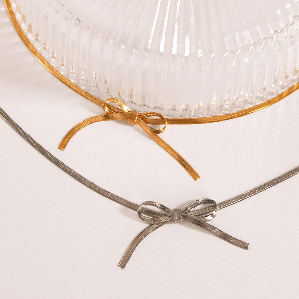 Asymmetrical Bow Knot Pendant Necklace for Women in Stainless Steel with 18K Gold Plating on Snake Chain