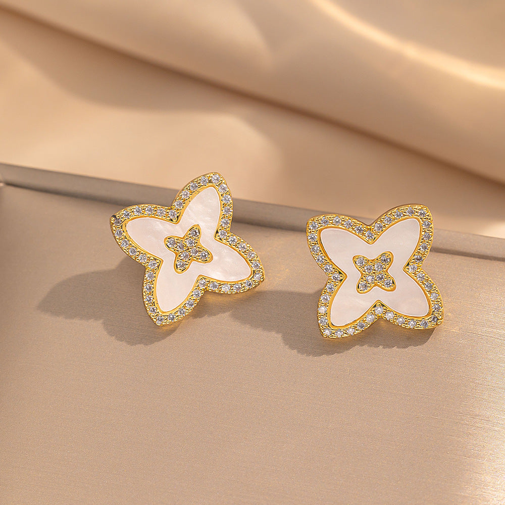 Orecchini a perno Saturno minimalisti color oro in ottone con zirconi per donna