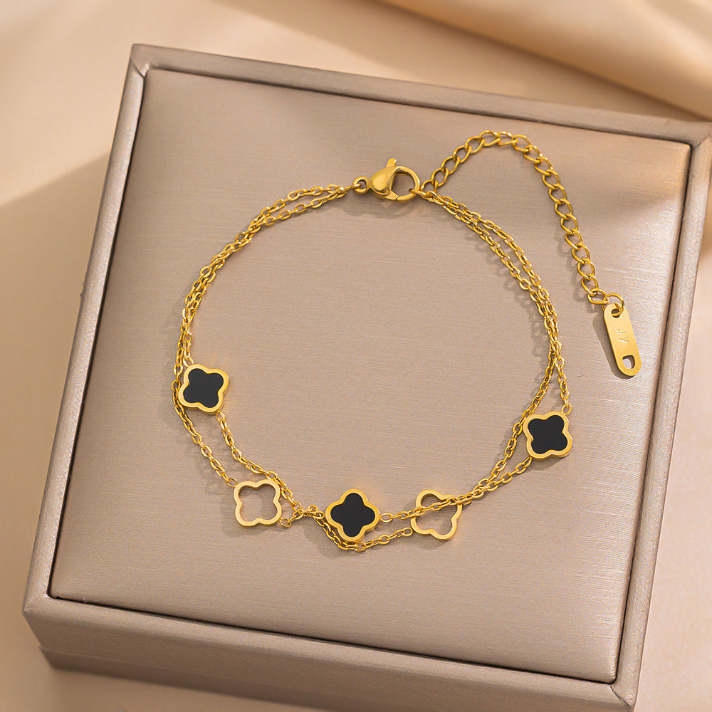 Bracciale da donna placcato in acciaio al titanio 18K con quadrifoglio cavo a doppio strato alla moda