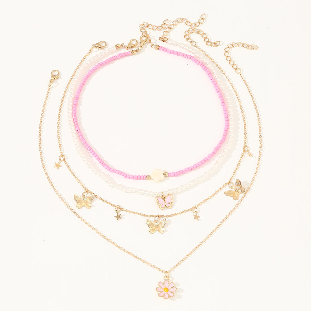 Set collana con pendente a farfalla rosa e floreale per bambini con perle in resina e ciondolo in lega, finitura smaltata, catena a sfere rotonde