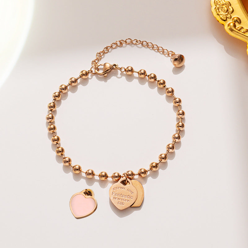 Bracciale minimalista da donna in acciaio al titanio a forma di cuore con finitura placcata