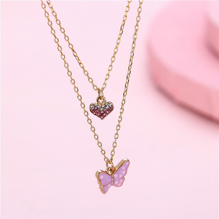 Collana con Ciondolo a Farfalla Minimalista Dolce per Ragazze in Lega Multistrato con Ciondolo a Cuore Smaltato Color Caramella e Catena a Croce