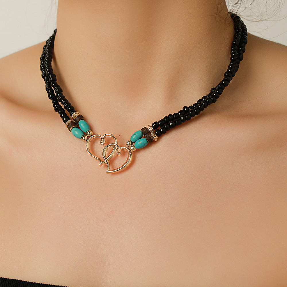 Collana da donna fatta a mano a doppio strato a forma di cuore in lega con perline turchesi su catena a O