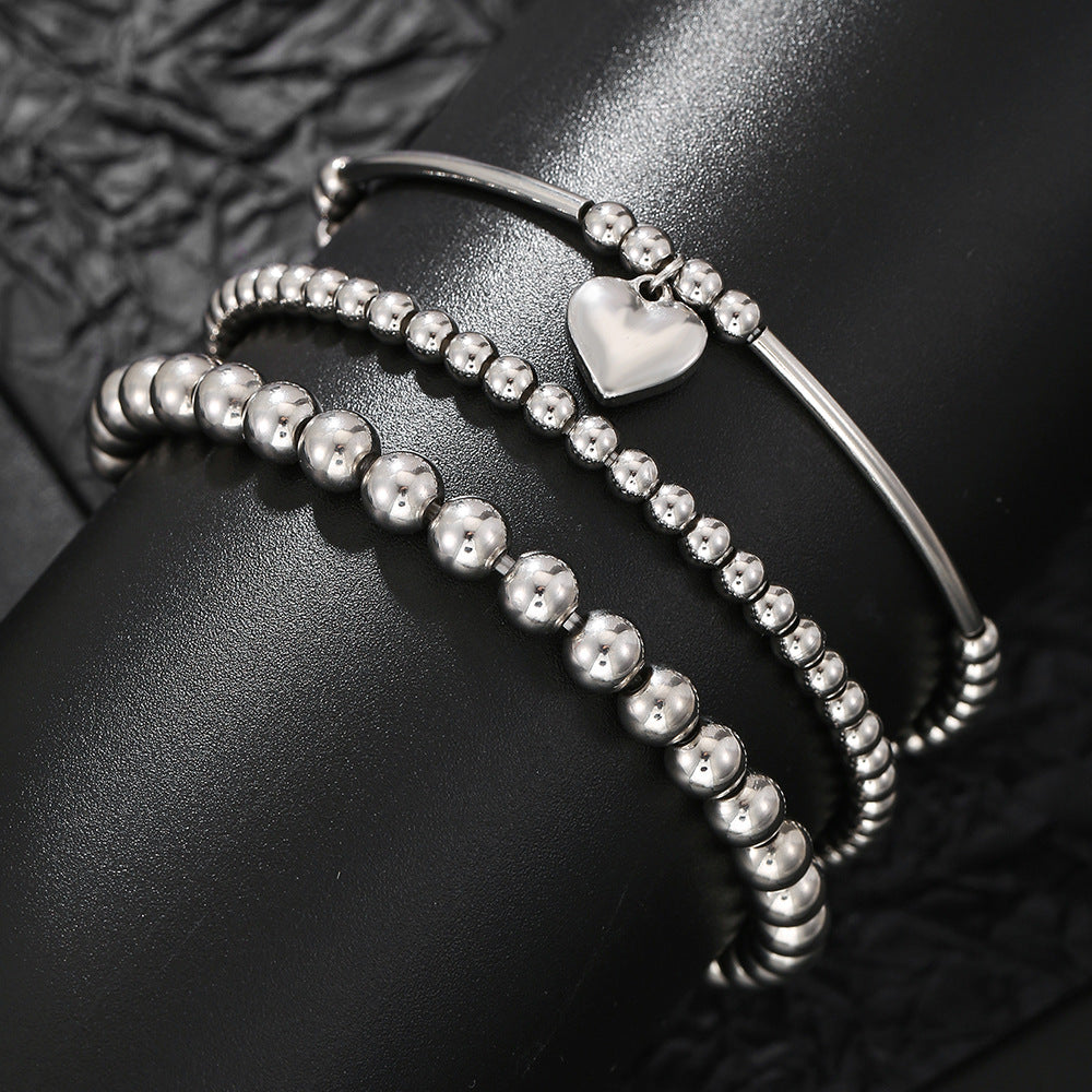Set bracciale con ciondolo a cuore geometrico in acciaio inossidabile da donna con perline miste e design impilabile
