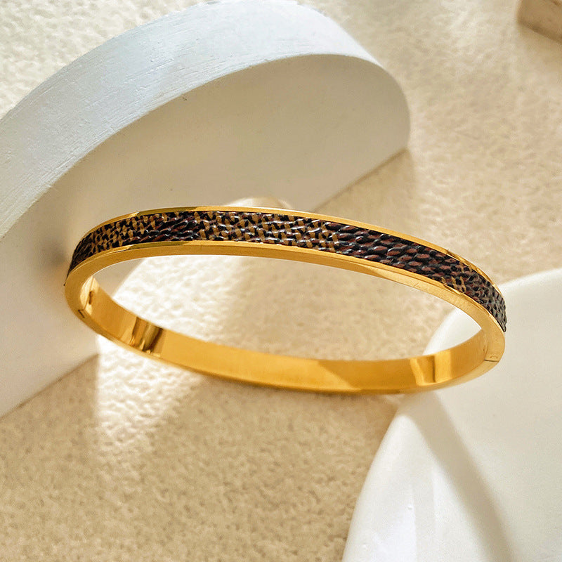 Minimalist Titanium Steel Plated Bracelet with Black Leather Texture