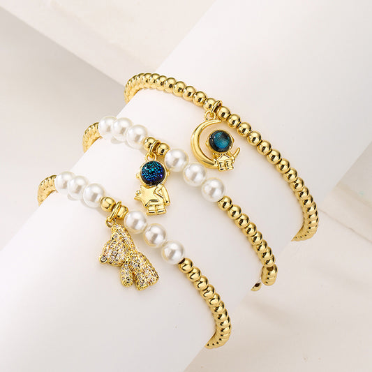 Pulsera Colgante de Oso Astronauta Creativo para Mujer con Cuentas de Cobre y Chapado en Oro de 18K