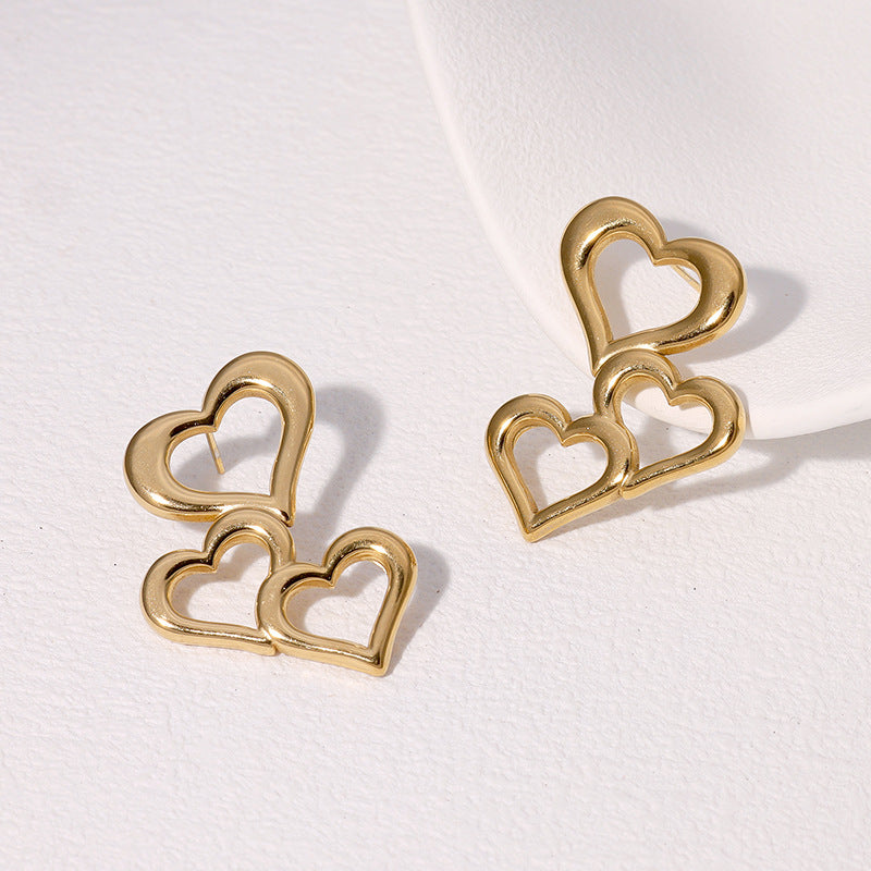 Orecchini a perno minimalisti da donna in acciaio inossidabile a forma di cuore cavo con finitura placcata
