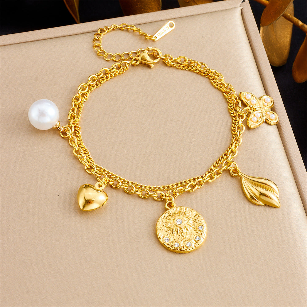 Bracciale con ciondolo floreale e a cuore in stile vintage in acciaio inossidabile con finitura placcata da donna