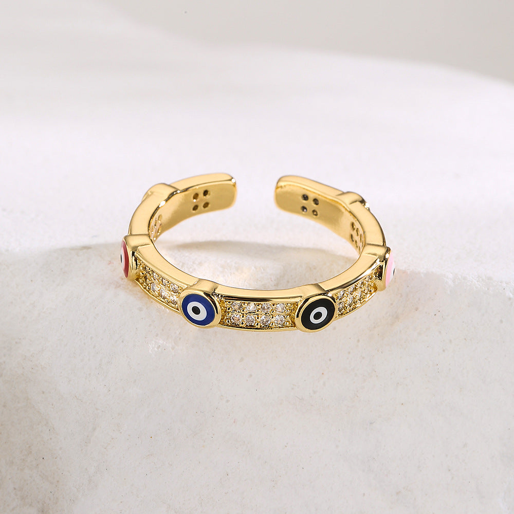 Anello geometrico aperto da donna con base in rame placcata in oro vero e testa di toro e design del pianeta in zircone micropavé