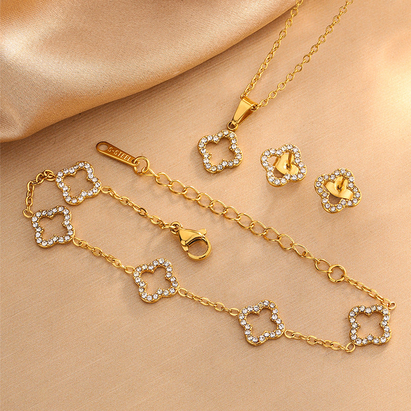 Elegante Juego de Collar de Acero Inoxidable con Trébol de Cuatro Hojas y Circonitas Cúbicas con Pulsera y Pendientes a Juego para Mujer