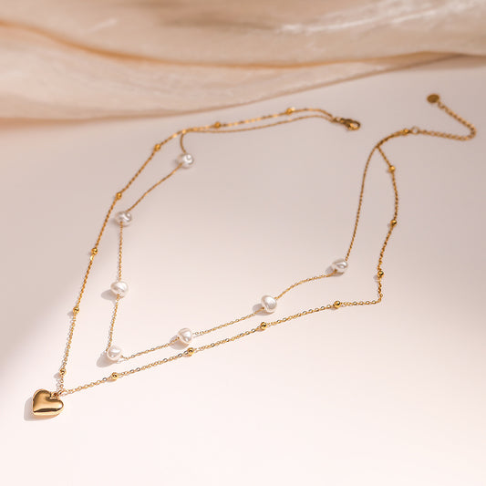 Collana con ciondolo a cuore minimalista in acciaio inossidabile con accenti di perle da donna, catena a doppio strato alla clavicola
