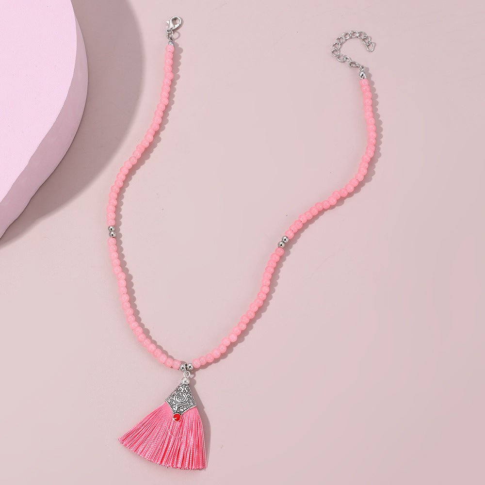 Collana pendente con nappe in stile bohémien per bambini, realizzata in perline di vetro con nappe abbinate su catena di perline rotonde