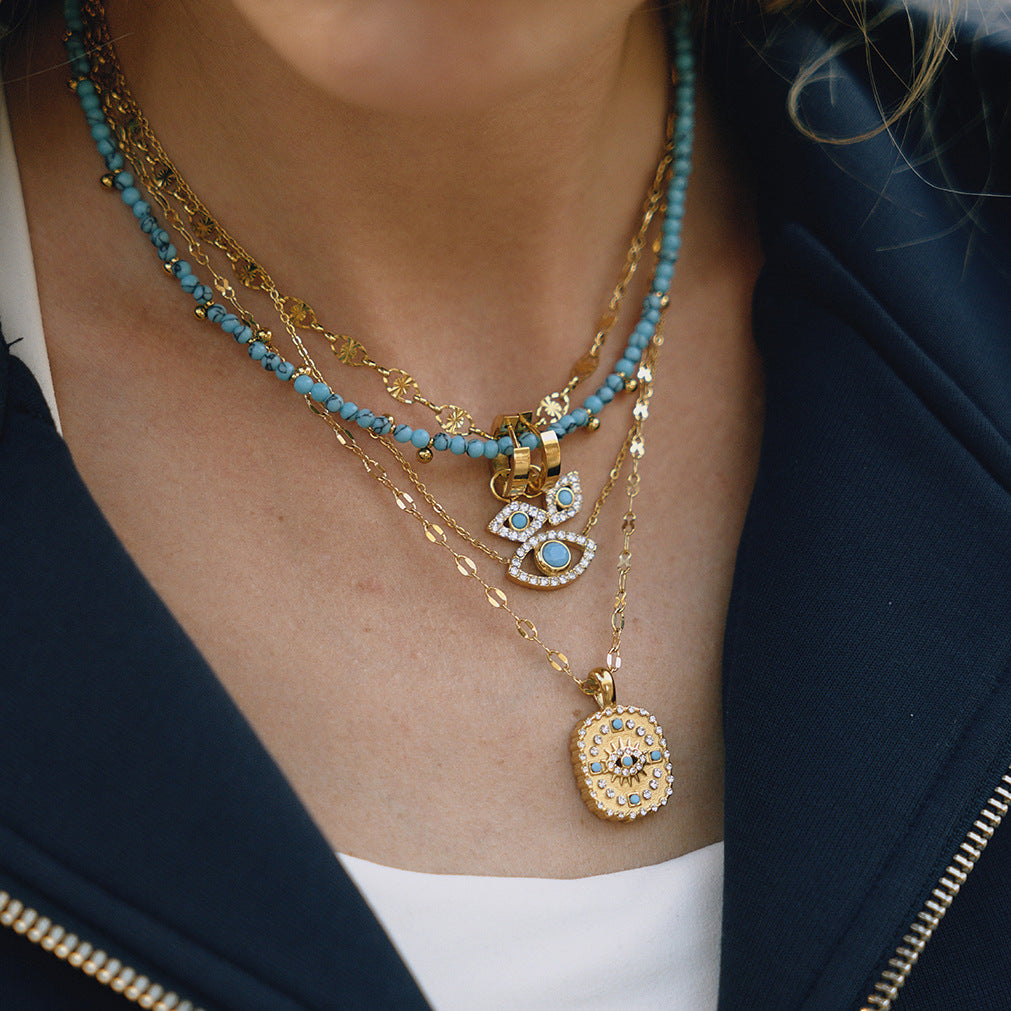 Collar con colgante de ojo turco azul geométrico de acero de titanio con acabado chapado para mujer