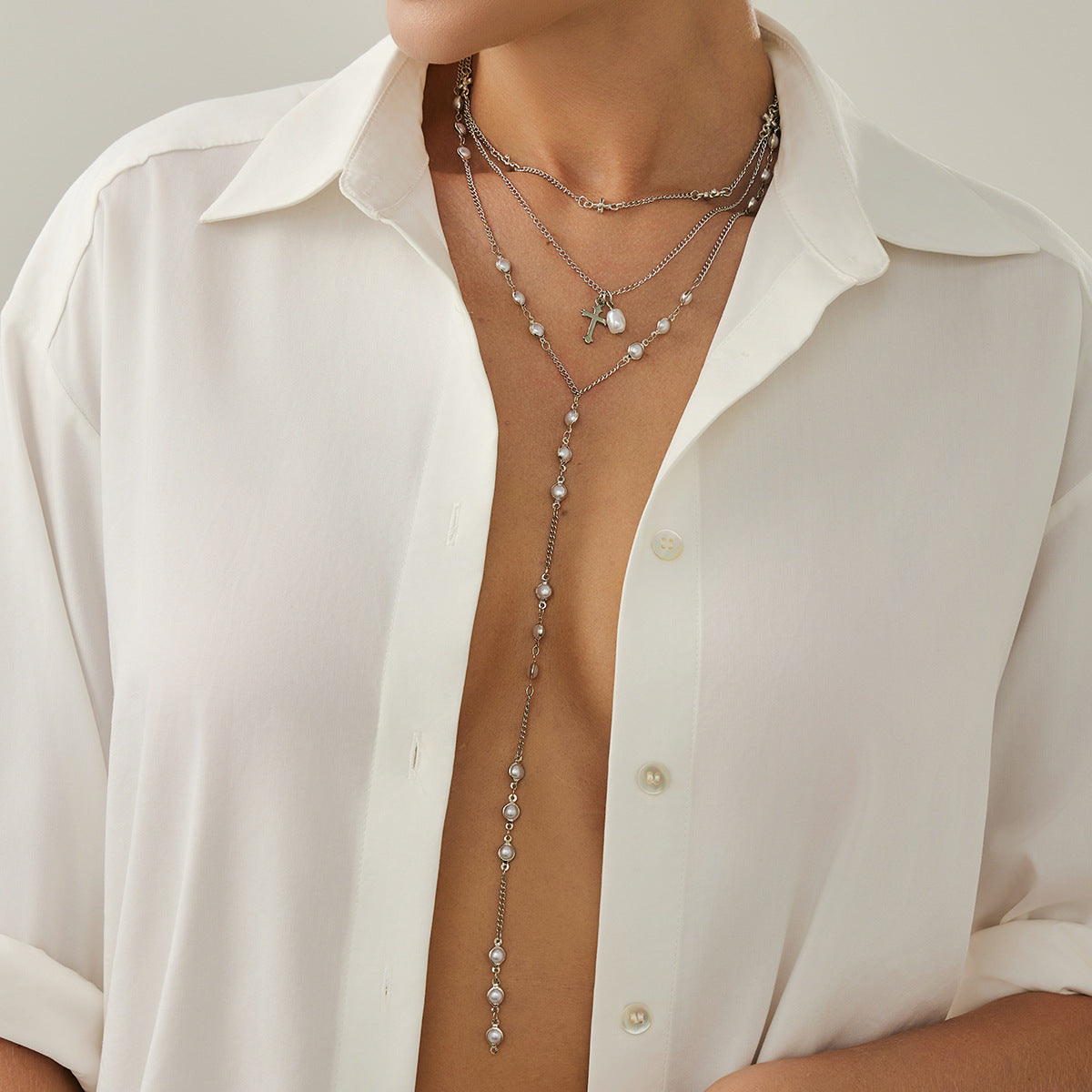 Colgante cruzado de estilo Ins con detalles de borlas en collar en Y de aleación con acabado tipo perla para mujer