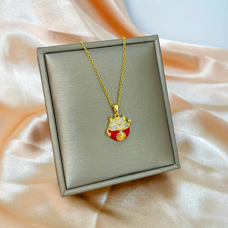 Collana con ciondolo girevole a quadrifoglio in acciaio al titanio con zirconi micropavé da donna
