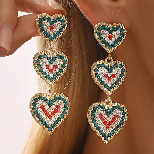 Pendientes de aleación con forma de corazón, temática navideña, incrustaciones de diamantes de imitación y lazo decorativo para mujer