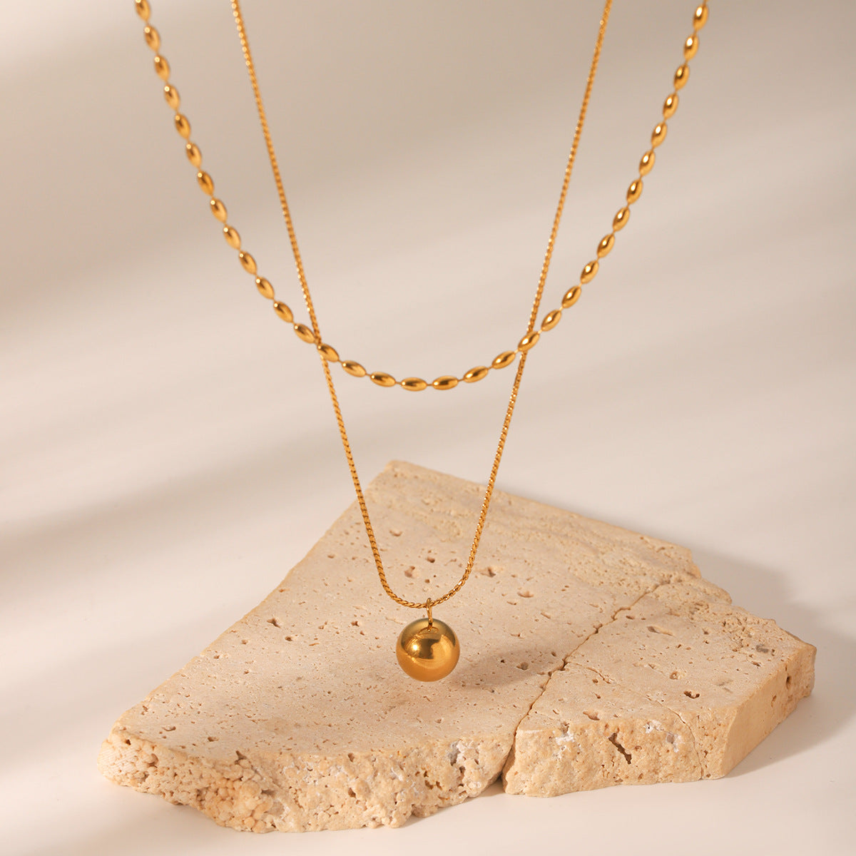 Minimalist Geometric Gold-Tone Stainless Steel Double-Layer Necklace with Small Spherical Pendant and Twisted Chain
