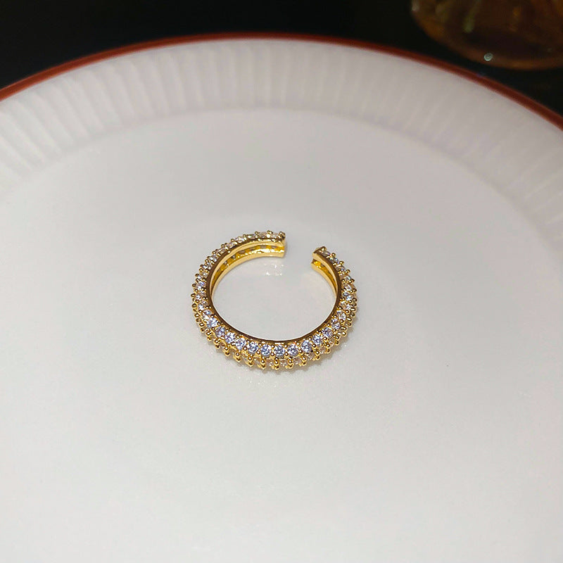 Anello da donna aperto a rombo a forma di fiore di iris in rame con intarsio di zirconi, ispirato al vintage
