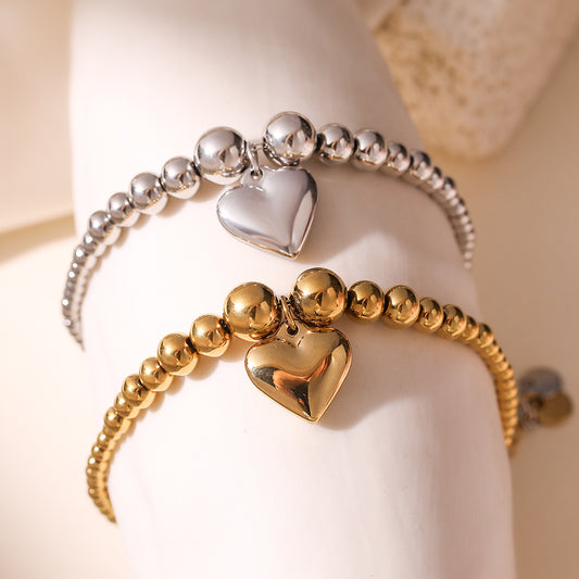 Pulsera minimalista de acero inoxidable con forma de corazón y acabado chapado para mujer