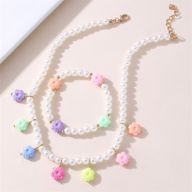 Dulce juego de collar y pulsera de cristal con nudo floral para niñas con colgante de aleación en colores pastel de helado