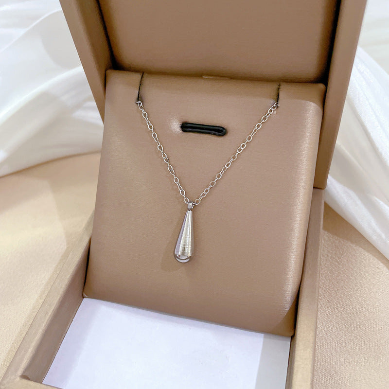 Collana minimalista con pendente a goccia geometrica in acciaio al titanio, unisex, con catena di estensione