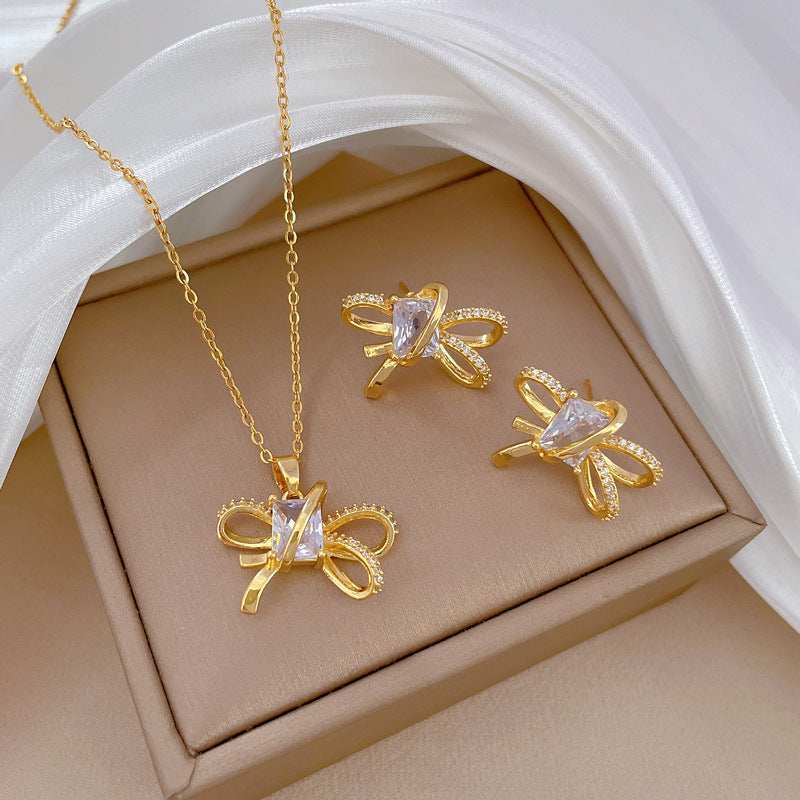 Set collana e orecchini minimalisti con fiocco in acciaio al titanio placcato per donna
