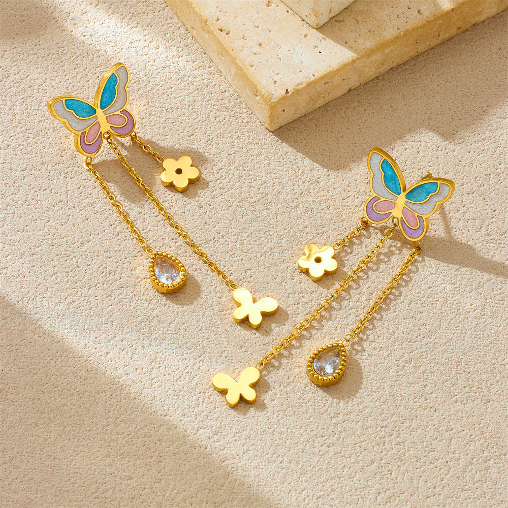 Orecchini a farfalla in stile cartoon, con smalto a colore sfumato, gocce intarsiate con strass, catena a nappa e perni in acciaio inossidabile