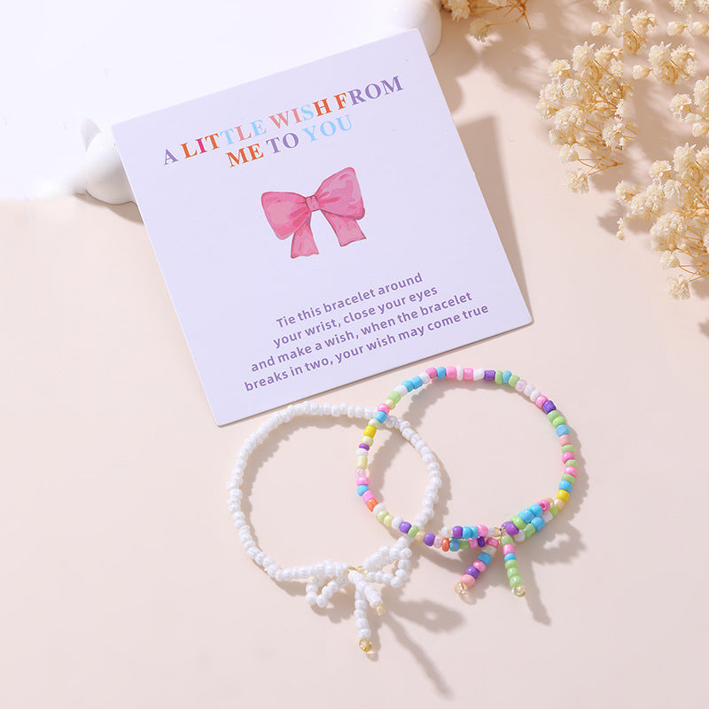 Set di braccialetti per bambini in stile bohémien con fiocco in perle di plastica e resina con accenti di cristallo bianco