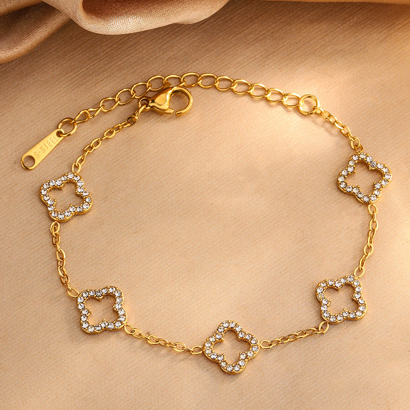 Elegante Juego de Collar de Acero Inoxidable con Trébol de Cuatro Hojas y Circonitas Cúbicas con Pulsera y Pendientes a Juego para Mujer