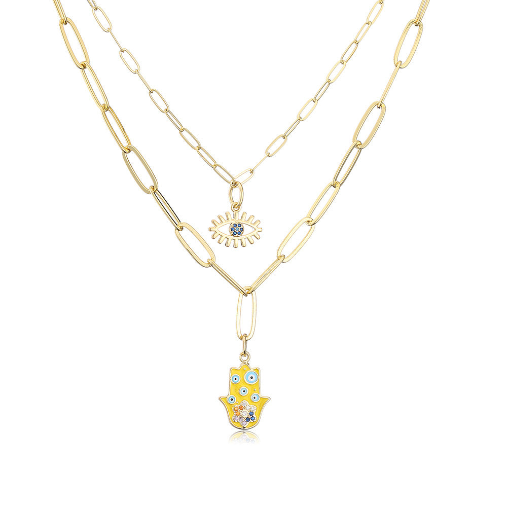 Collana con ciondolo minimalista a mano e occhio per donna in rame con finitura smaltata e intarsi in strass su catena placcata oro 18 carati