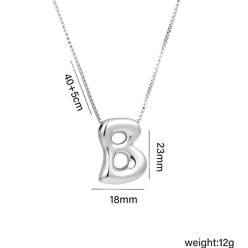 Collar con colgante de acero titanio con forma de letra minimalista y chapado en oro para mujer