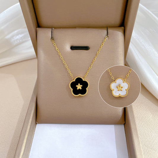 Collana girocollo minimalista in acciaio al titanio con motivo floreale geometrico unisex