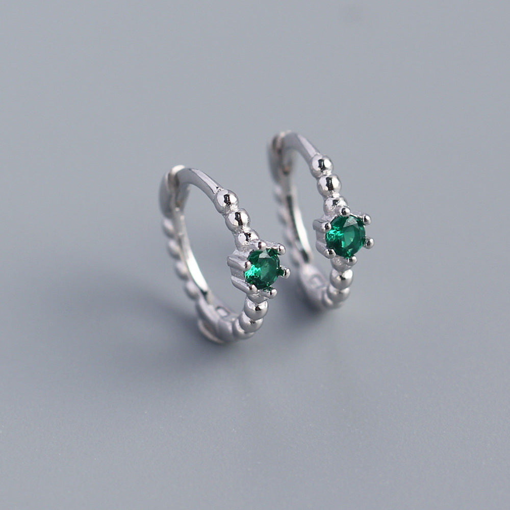 Orecchini a perno tondi con intarsi di diamanti in argento sterling 925