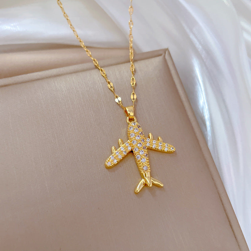 Collar con colgante de avión de combate de lujo con diamantes de imitación para mujer y hombre, cadena de eslabones geométrica de acero de titanio con motivo de luna