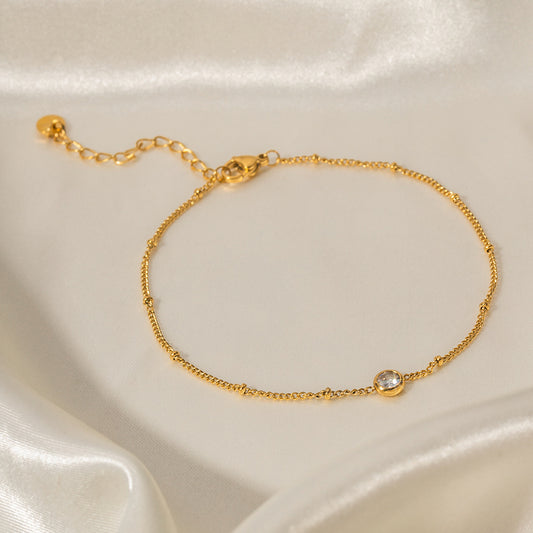 Cavigliera retrò geometrica INS in acciaio al titanio placcato oro 16K con intarsio in zircone bianco da donna
