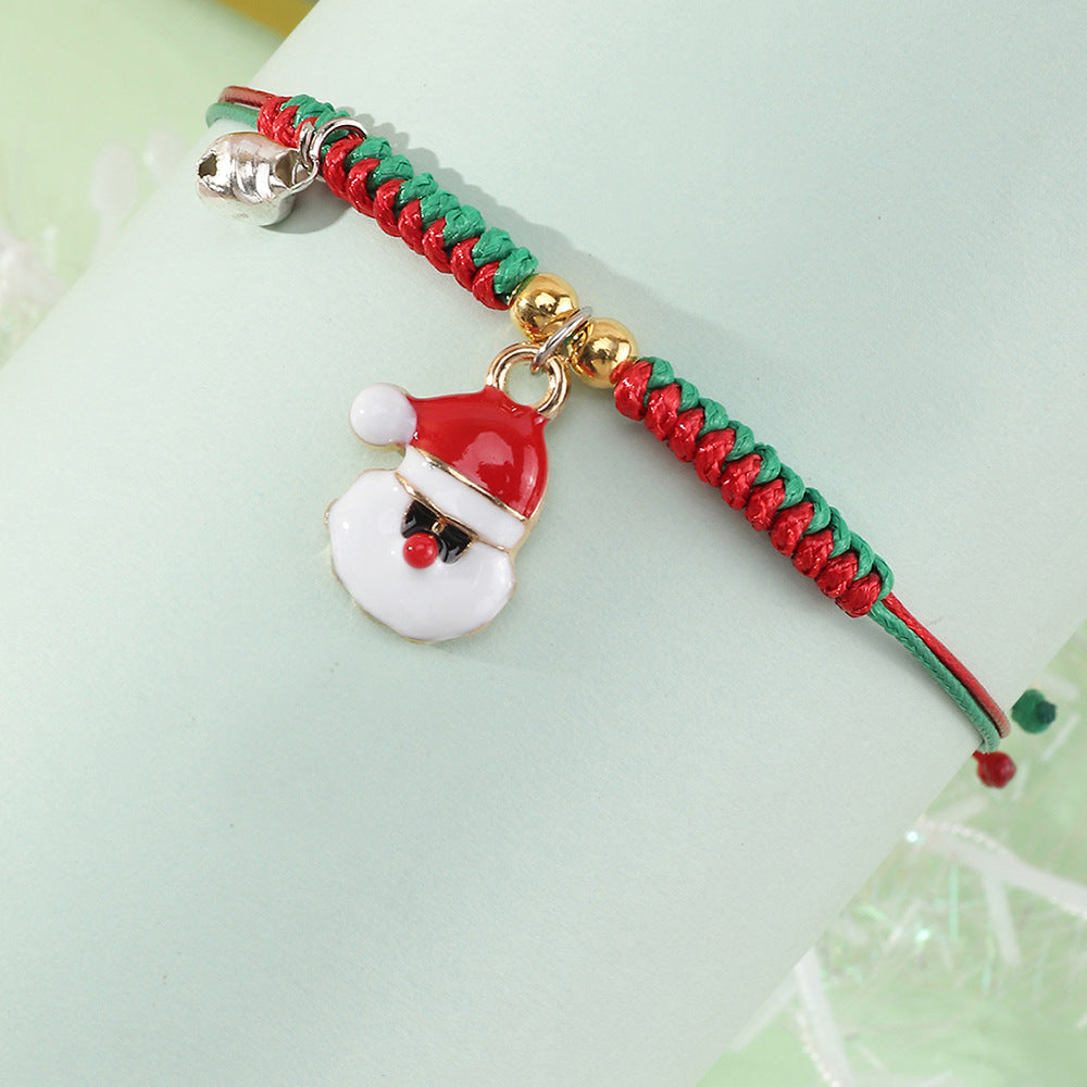 Bracciale Natalizio Artigianale Regolabile da Bambina con Ciondolo Babbo Natale in Cordino di Poliestere Rosso e Verde, Gioiello Festivo