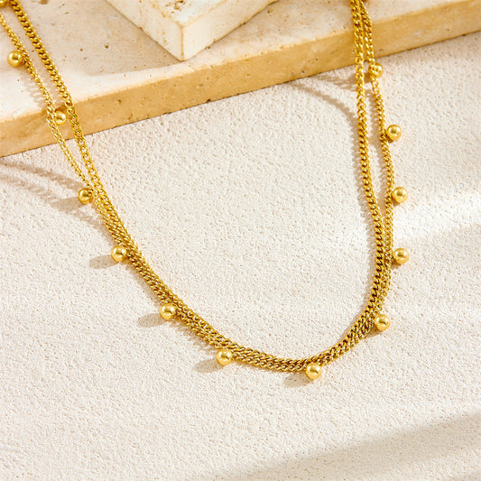 Collar minimalista de doble capa chapado en oro con cuentas redondas de acero inoxidable para mujer
