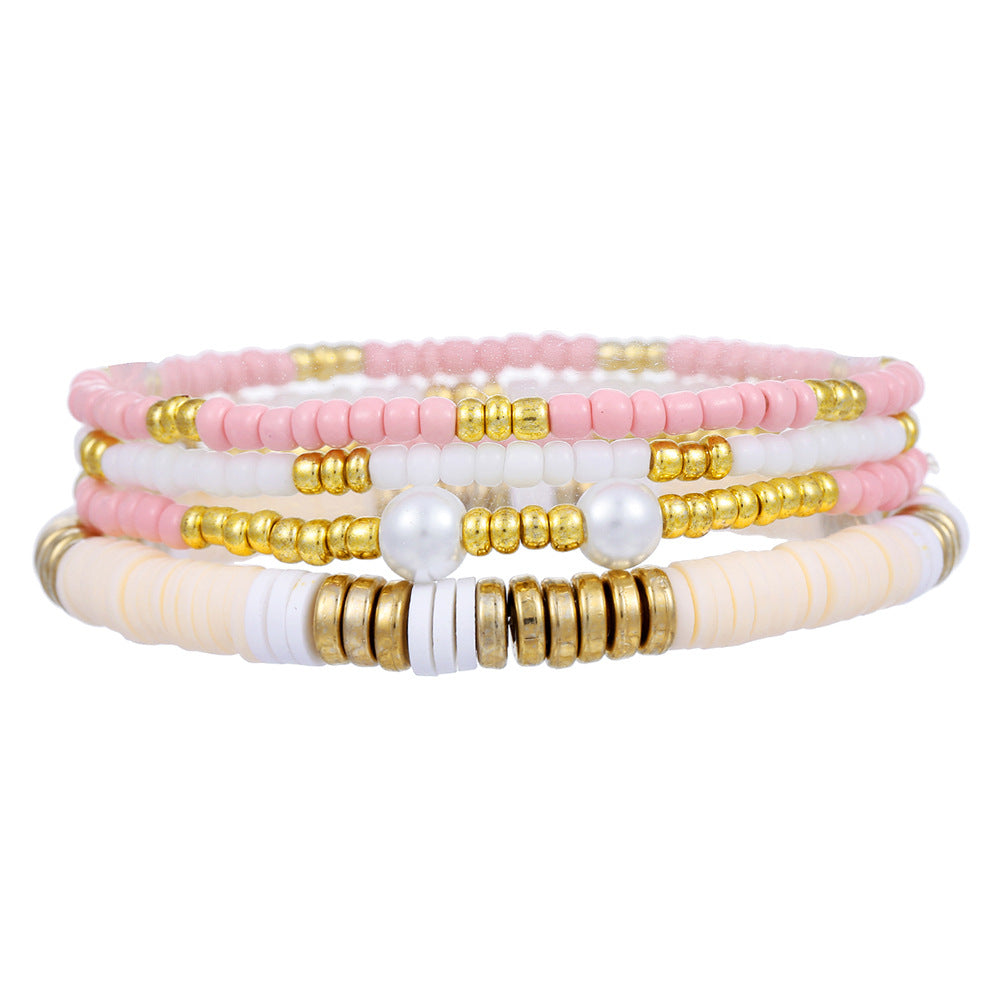Set di bracciali impilabili bohémien con perle in argilla polimerica, forme geometriche e accenti di perle colorate da donna