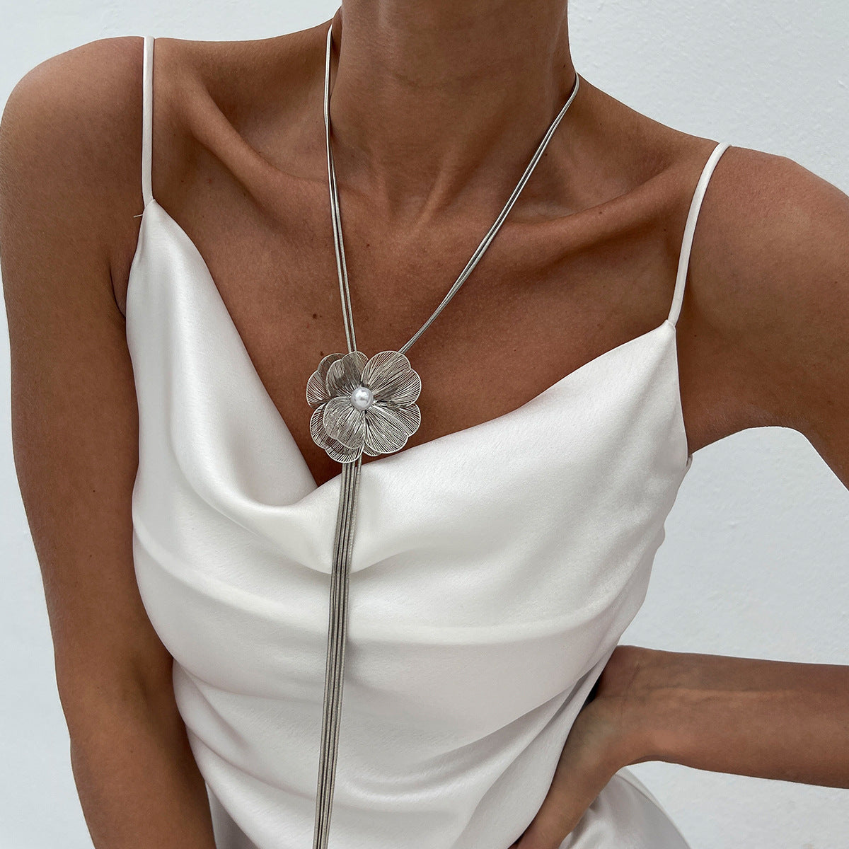 Minimalist Ginkgo Leaf Long Tassel Necklace with Hollow Floral Pendant, Electroplated Copper Chain and Simulated Pearl Accents for Women