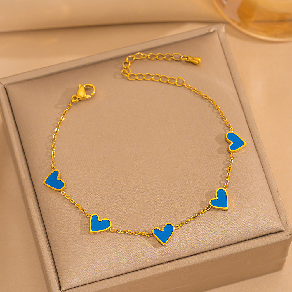 Pulsera minimalista de lujo ligero con forma de corazón de acero de titanio con PVD y oro blanco de 18 quilates y nácar para mujer