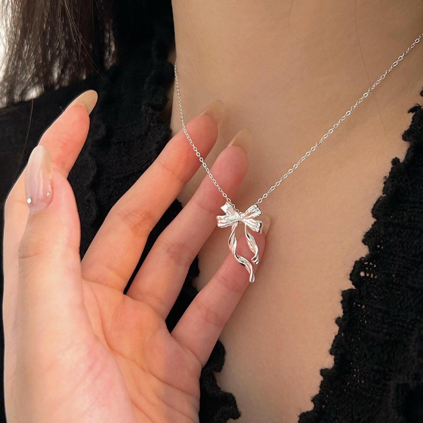 Minimalist Bow-Shaped Pendant Necklace in Sterling Silver with Gold Plating on Cross Chain