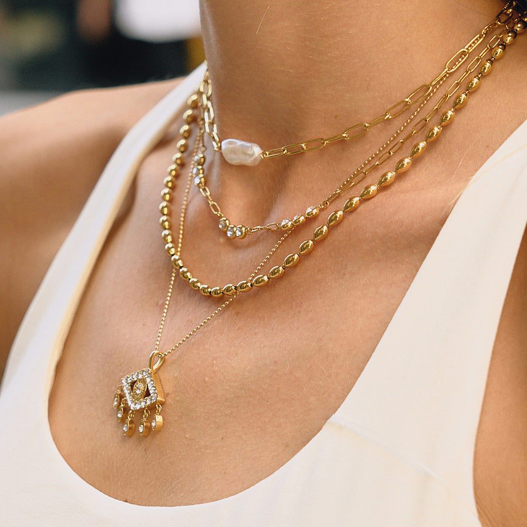 Collar con colgante de ojo demoníaco geométrico con borla de acero de titanio y diamantes de imitación, collar de moda de acero inoxidable galvanizado para mujer