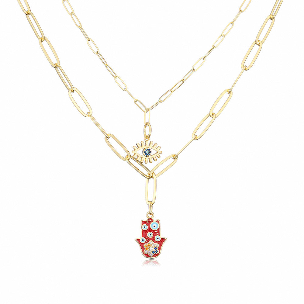 Collana con ciondolo minimalista a mano e occhio per donna in rame con finitura smaltata e intarsi in strass su catena placcata oro 18 carati