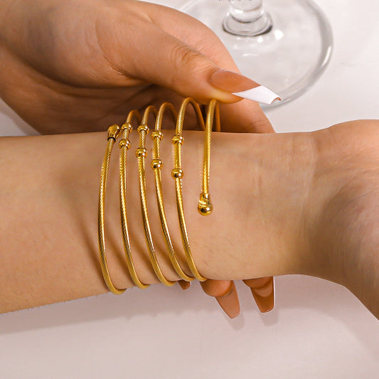 Bracciale da donna in acciaio inossidabile intrecciato a torsione irregolare stile Ins con finitura placcata