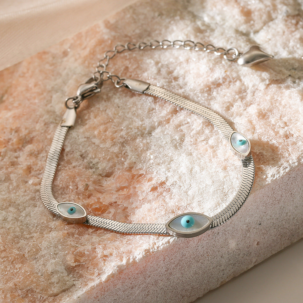 Bracciale minimalista a occhio di Allah in acciaio al titanio con pavé per donna