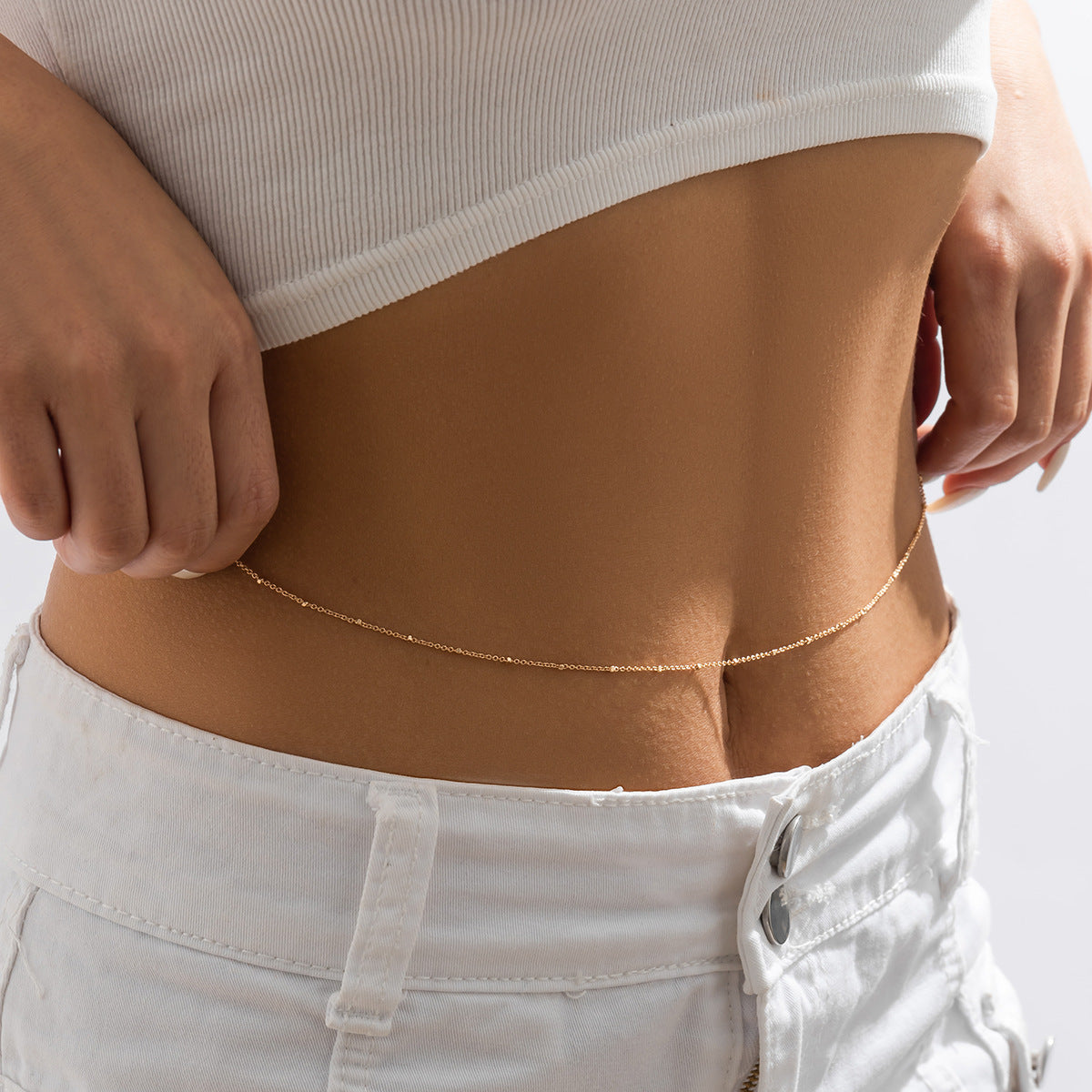 Cadena corporal minimalista para mujer con delicadas cuentas de metal y diseño de cintura de una sola capa